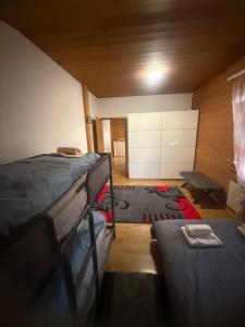 a room with two bunk beds and a rug at Ferienwohnung Happy Life Thun in Steffisburg +12 photos