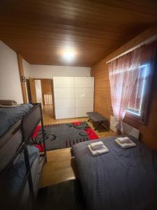 a bedroom with a bed and a window in a room at Ferienwohnung Happy Life Thun in Steffisburg