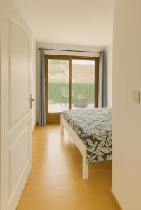 Postel nebo postele na pokoji v ubytování La Maison accueillante pour les pros et tourisme