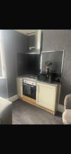 a kitchen with a stove in a room at Levy Nook 8 in Darlington