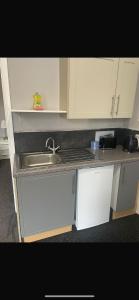 a kitchen with a sink and a counter top at Levy Nook 8 in Darlington +6 photos