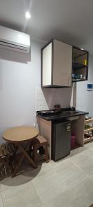 a kitchen with a table and a table and a counter at Mirage Bay hotel in Hurghada