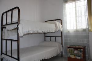 Postel nebo postele na pokoji v ubytování Villa Mercedes Peñoncillo