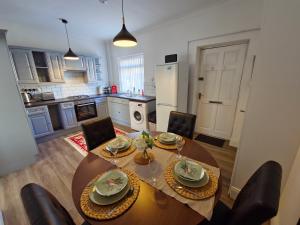 a kitchen and dining room with a table and chairs at Ushaw HillTop View in Ushaw Moor +8 photos