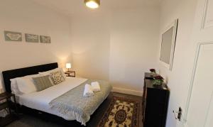 a small bedroom with a bed and a rug at Ushaw HillTop View in Ushaw Moor