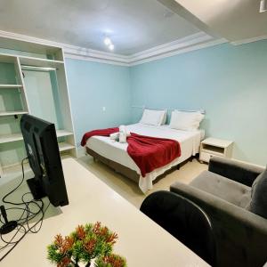 Μια τηλεόραση ή/και κέντρο ψυχαγωγίας στο Pousada Morada Coqueiros