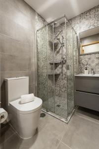a bathroom with a toilet and a shower at Casa Azul in Ferrel +9 photos