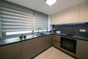 a kitchen with a sink and a counter top at Comfy 2BR Flat in Central Athens in Athens
