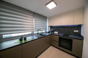 a kitchen with a sink and a counter top at Comfy 2BR Flat in Central Athens in Athens