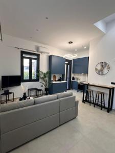 a living room with a couch and a table at Helios 2 in Chios