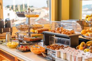 a buffet line with many different types of food at Hotel Kraft in Florence