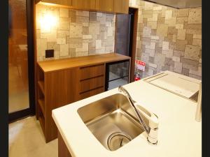 a kitchen with a sink and a counter at DS2&3 - Vacation STAY 62445v in Tajiri +48 photos