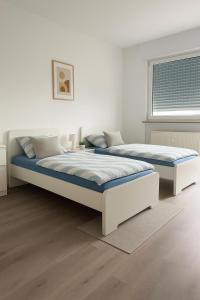 Postel nebo postele na pokoji v ubytování Monteur- und Ferienwohnung Viernheim