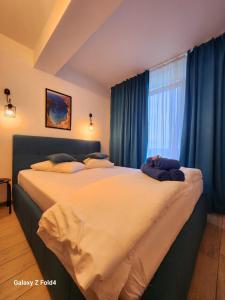 Ένα ή περισσότερα κρεβάτια σε δωμάτιο στο Sea Breeze ApartHotel - Beach Pool & Spa Resort