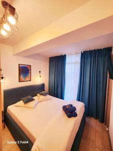 Ένα ή περισσότερα κρεβάτια σε δωμάτιο στο Sea Breeze ApartHotel - Beach Pool & Spa Resort