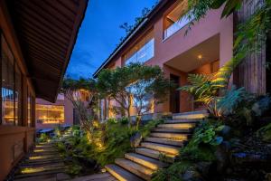 a set of stairs in front of a building at GengYun Hot Spring Resort Hotel in Niujie