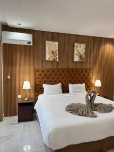 Ένα ή περισσότερα κρεβάτια σε δωμάτιο στο Duplex Menara Mall