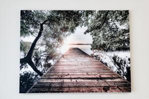 a wooden bridge over a body of water at Apartamenty EUROPA in Jasło