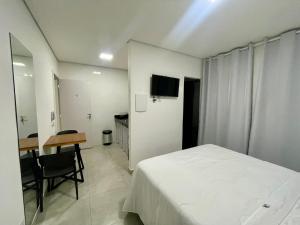 Un televizor și/sau centru de divertisment la Hospedaria Central