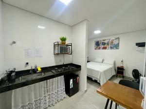 Un pat sau paturi într-o cameră la Hospedaria Central