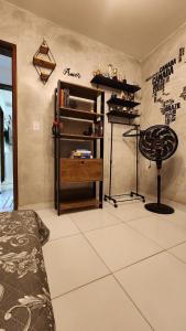 a bedroom with a bed and a desk and a table at Apartamento com dois quartos a 300m da praia in Cabedelo +25 photos