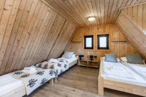 Postel nebo postele na pokoji v ubytování Łobrotno Gaździna - góralska chałupa na wyłaczność