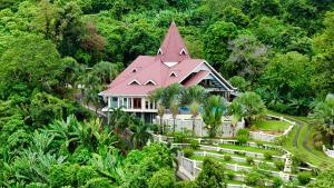 an aerial view of a house with a red roof at The Diamond Villa - Private Pool, Jacuzzi & Views in Pantai Cenang