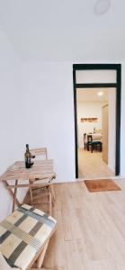 a living room with a table and a dining room at Casa dos Sequeiras Port Rosé in Vila Nova de Gaia