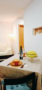 a table with a plate of food on it at Casa dos Sequeiras Port Rosé in Vila Nova de Gaia