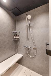 a bathroom with a shower with a shower head at 福宿美空 Fukuyado Misora in Fukuoka