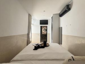 a bedroom with a bed with a laptop on it at Riad Manoury Marrakech - privates Boutique-Hotel für 6 in Marrakesh