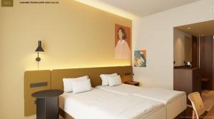 Ένα ή περισσότερα κρεβάτια σε δωμάτιο στο Hampton by Hilton Bordeaux Merignac Airport