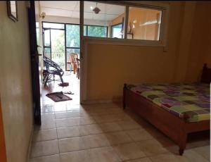 a bedroom with a bed and a mirror on the wall at Sky View Kandy in Kandy