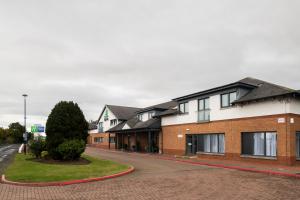 a row of houses on a street at Holiday Inn Express Edinburgh Airport by IHG in Ingliston +49 photos