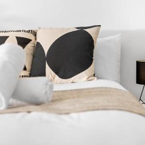 a white bed with pillows and a black and white at Modern Apartment - Pet Friendly - Fast Wi-Fi - Netflix - Wolverhampton 7PC in Wolverhampton +21 photos