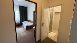 Postel nebo postele na pokoji v ubytování B&B Hotel Praha