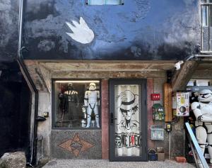 a front door of a building with statues on it at 九份玩具屋 in Ruifang
