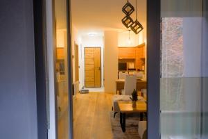 a hallway with a living room and a dining room at Residence Ali - garage included in Bjelašnica