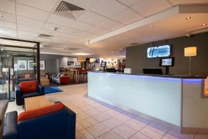 a lobby with a bar and a waiting room at Holiday Inn Express Perth by IHG in Perth