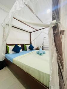 Postel nebo postele na pokoji v ubytování Lunai Hotel & Restaurant