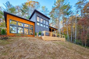 a small house on a hill in the woods at The Lighthouse in Ellijay