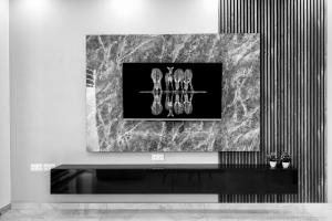 a black and white picture of shoes on a wall at Modern SeaView Luxury Apartment in St. Paul's Bay