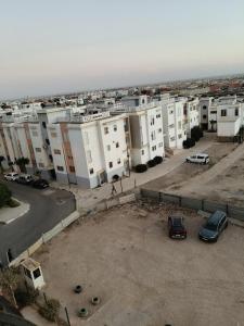 an aerial view of a city with white buildings at apartment for rent by the day in Agadir