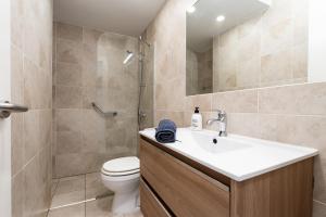 a bathroom with a sink and a toilet and a shower at Beach Side Apartments Calahonda in Sitio de Calahonda +32 photos