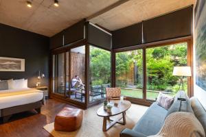 a bedroom with a bed and a living room at The Place in Santiago +82 photos