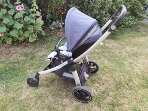 a stroller sitting on the grass in the yard at La Suite by Nath in Calais