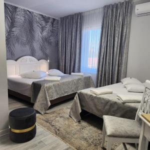 Postel nebo postele na pokoji v ubytování Hotel Mantra