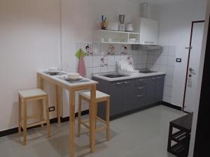 Kuchyň nebo kuchyňský kout v ubytování Coconoi Residence