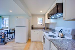 a kitchen with white appliances and a white refrigerator at Lake-View Spofford Apartment w/ Shared Dock! in Spofford