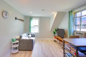 a living room with a couch and a table at Lake-View Spofford Apartment w/ Shared Dock! in Spofford